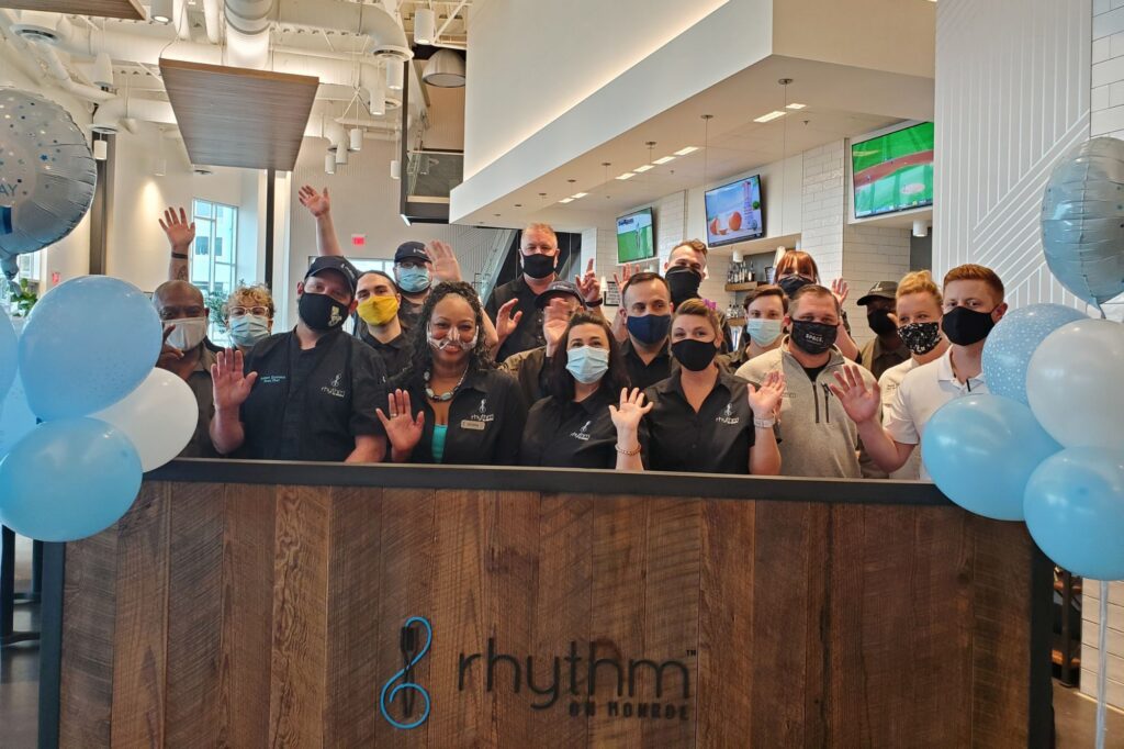 Photo of Rhythm On Monroe staff celebrating one year anniversary