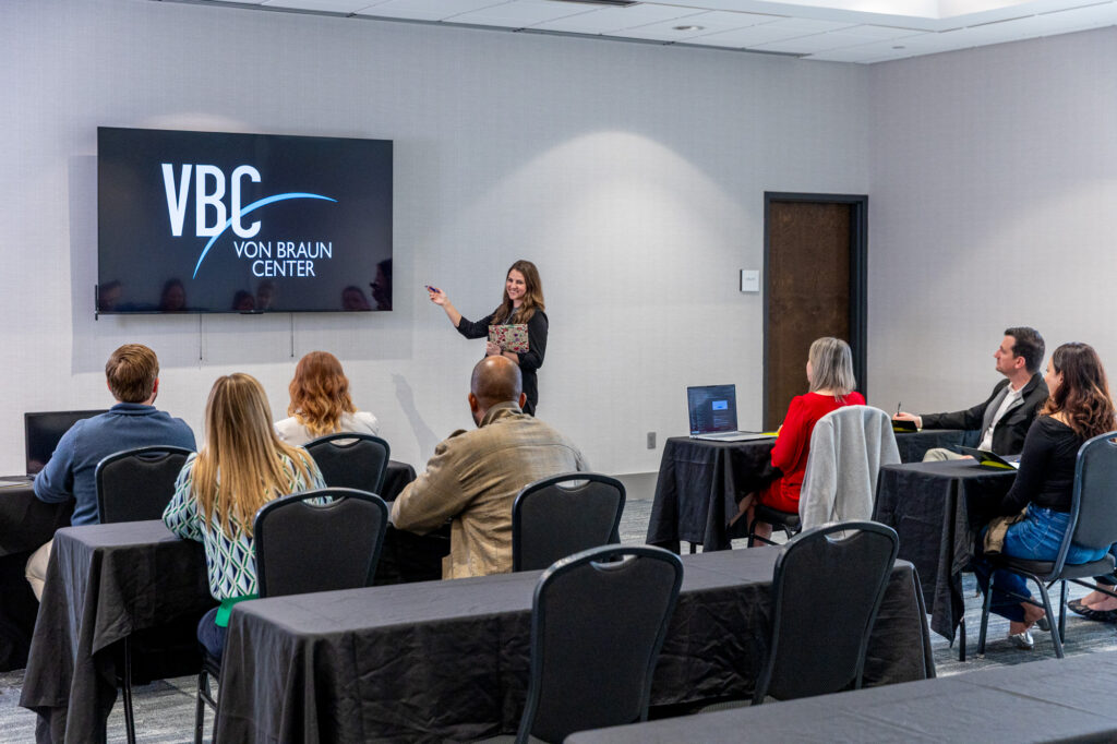 Photo of speaker giving a presentation to a group