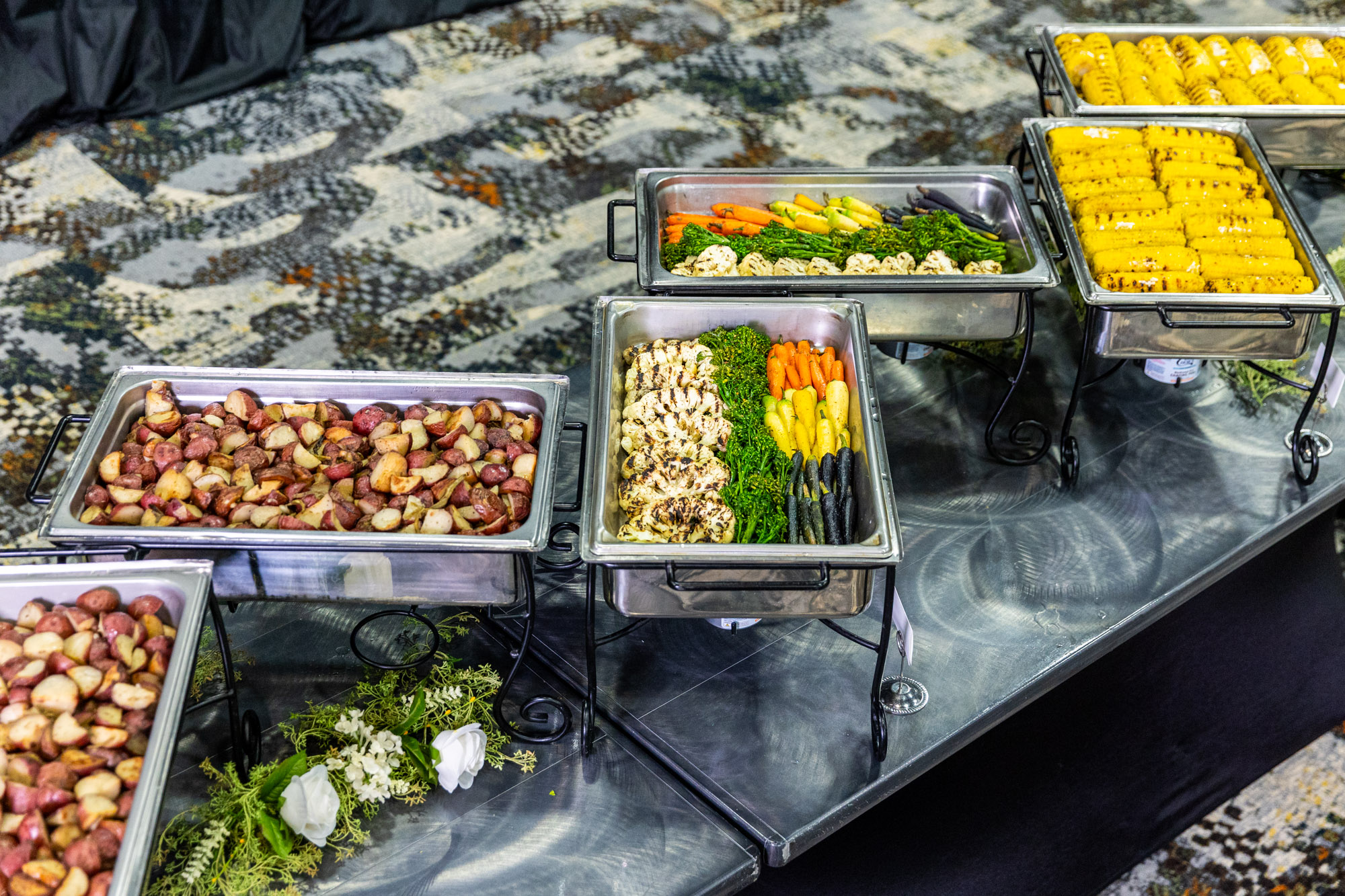 Photo of buffet dishes with vegetables and potatoes