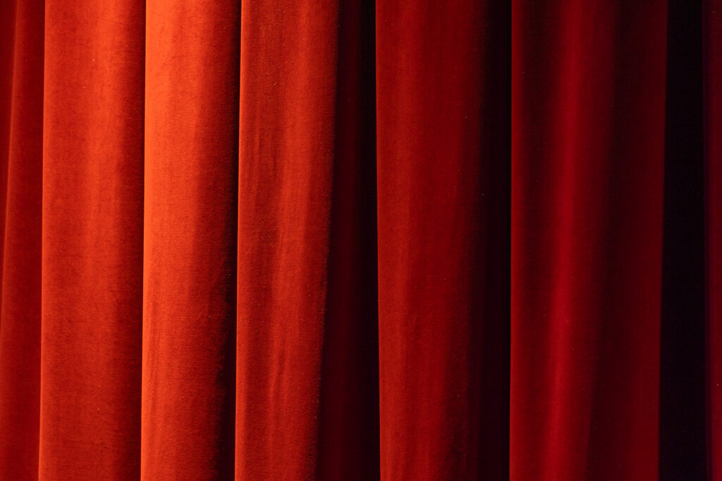 Close up image of red velvet curtain in Mars Music Hall