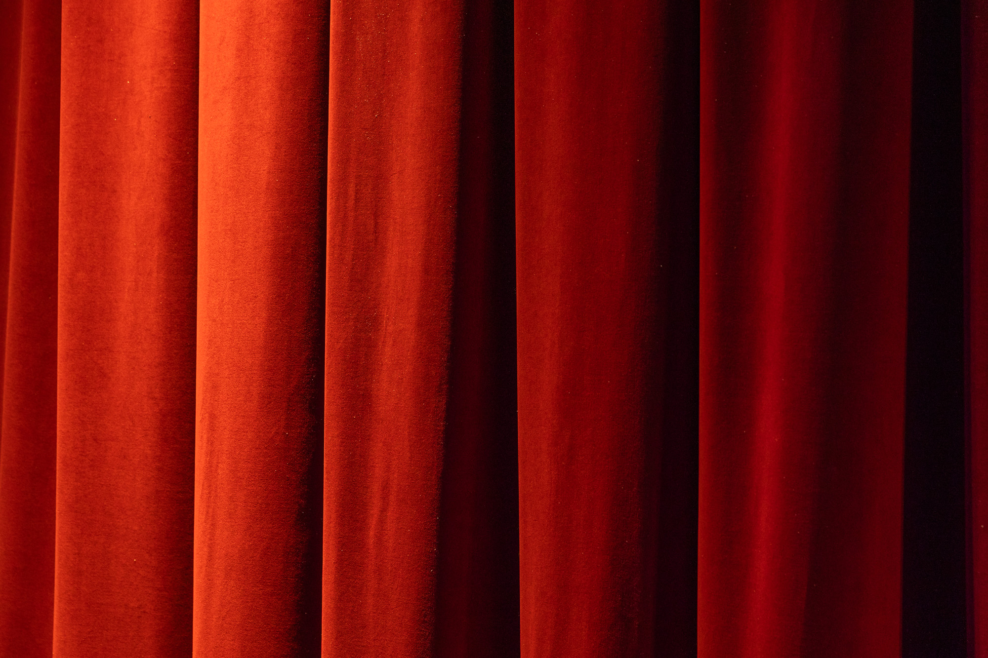 Close up image of red velvet curtain in Mars Music Hall