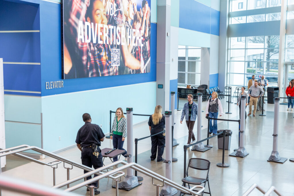 Image of guests entering a security checkpoint in the VBC Propst Arena