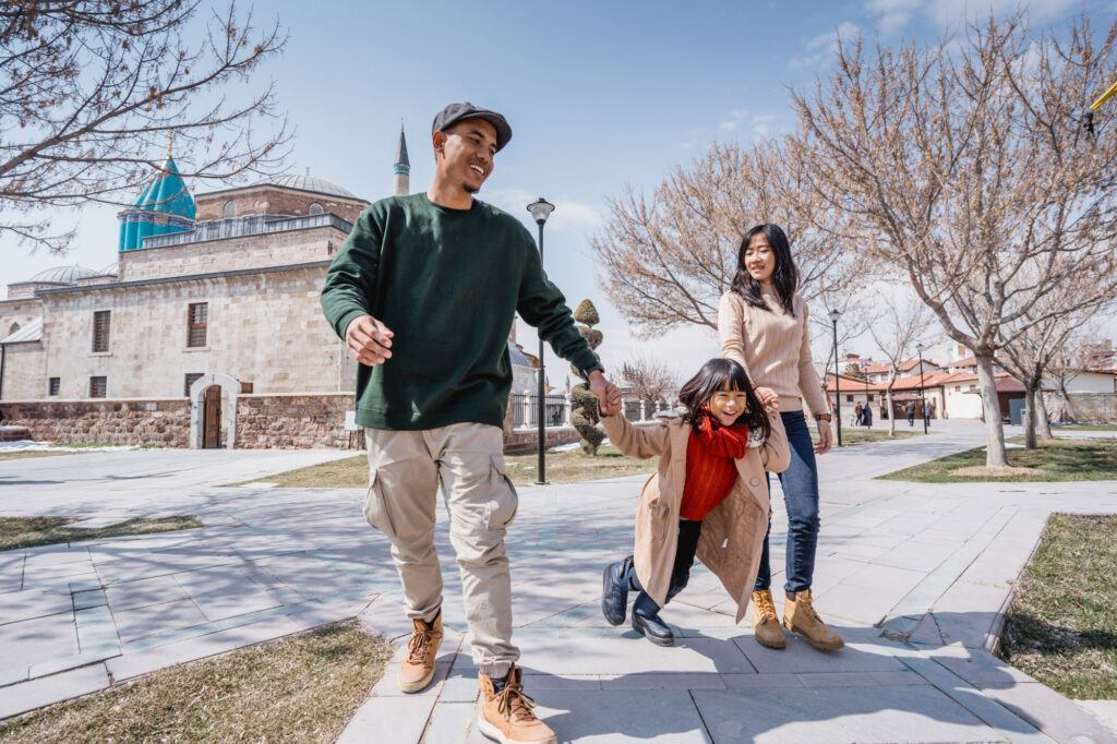 Image of a family walking through the park