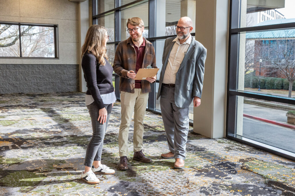 Image of guests talking at a meeting