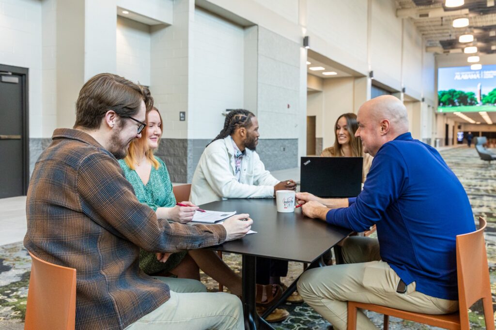 Image of guests collaborating at a conference
