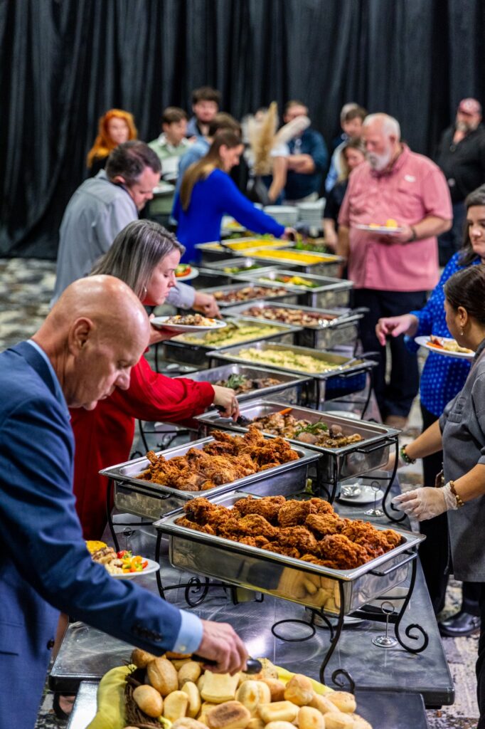 Photo of attendees making plate at VBC buffet setup