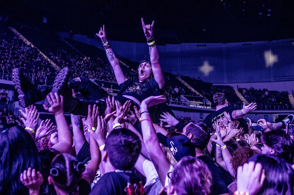 Photo of audience crowd surfing during Fit For A King concert in VBC Propst Arena