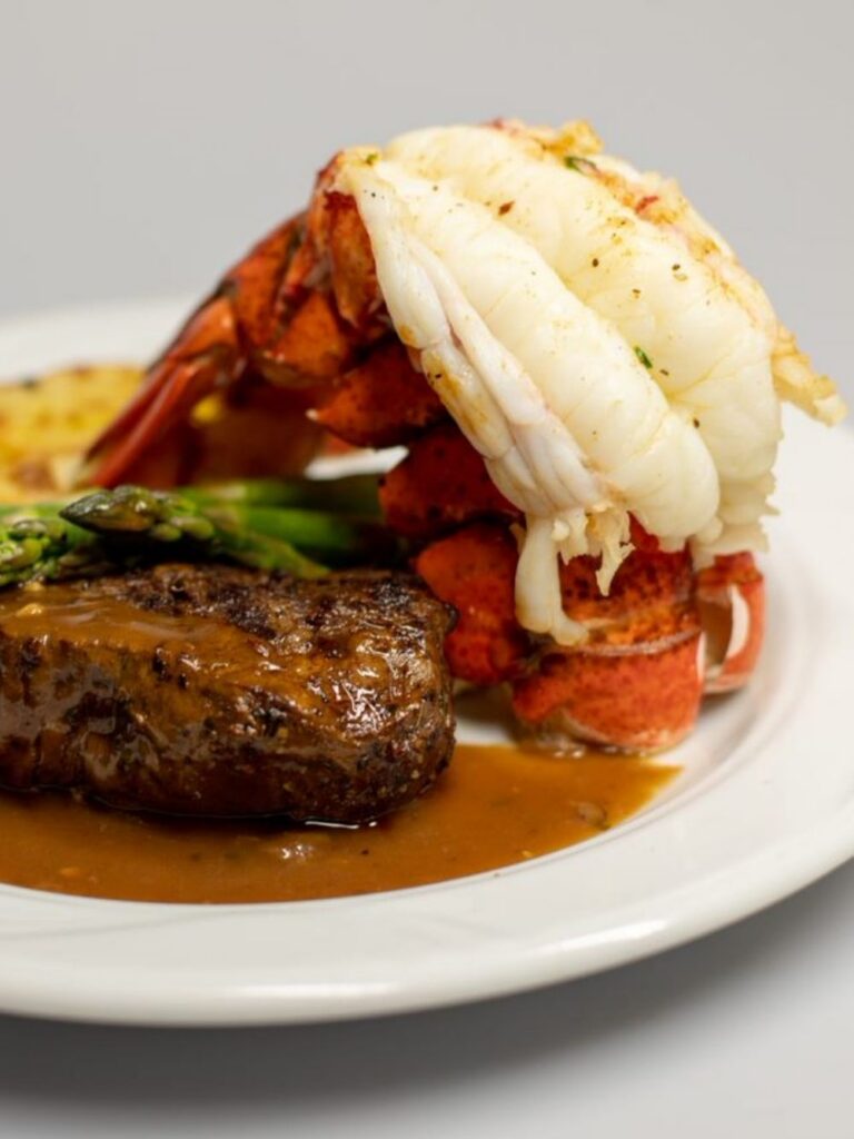 Photo of plated steak and lobster duo entree
