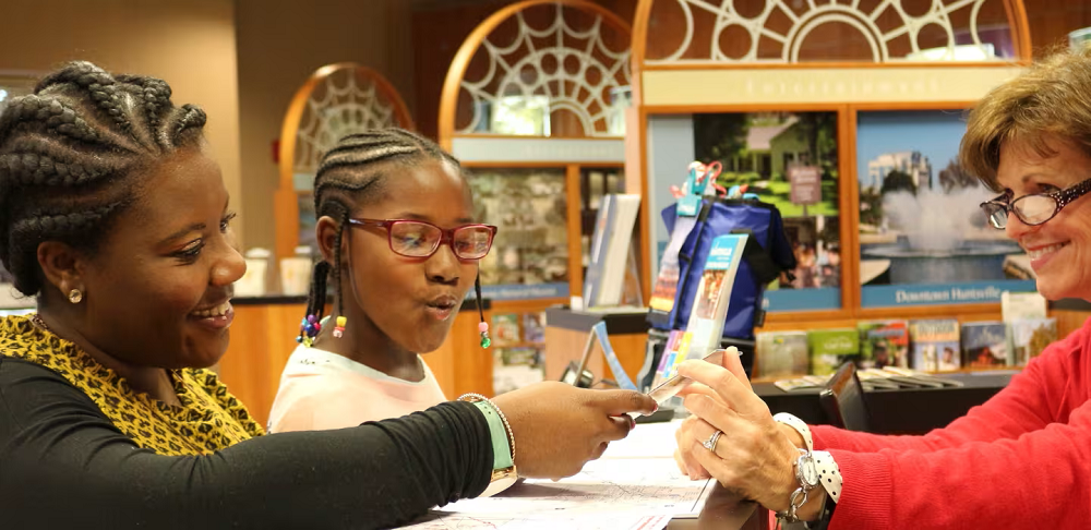 Photo of guests viewing pamphlets and brochures